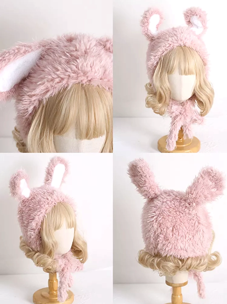 Back view of pink plush rabbit ear hat showing twisted long scarf straps and white trim lining