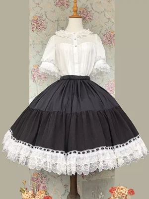 Pink lolita midi skirt with white ruffled lace hem and lace-up corset bust detail displayed on mannequin - front view with floral background