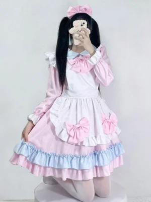 Maid Lolita dress half-body front shot detail of white apron pink-blue ruffled skirt trim and coordinating pink bows