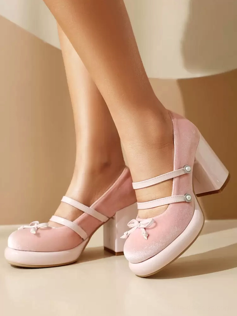 Pink nubuck Lolita Mary Jane pumps double feet side view with dual ankle straps pearl accents front bow chunky platform