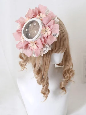 Pink pastoral lolita hair fascinator with pearl and flower lace accents, rear side view on mannequin with golden wig, showing romantic bow and mesh lace construction