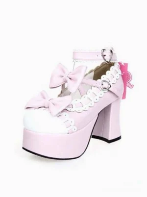 Single pink platform lolita high heel three-quarter front side view showing decorative bow and scalloped lace trim detail