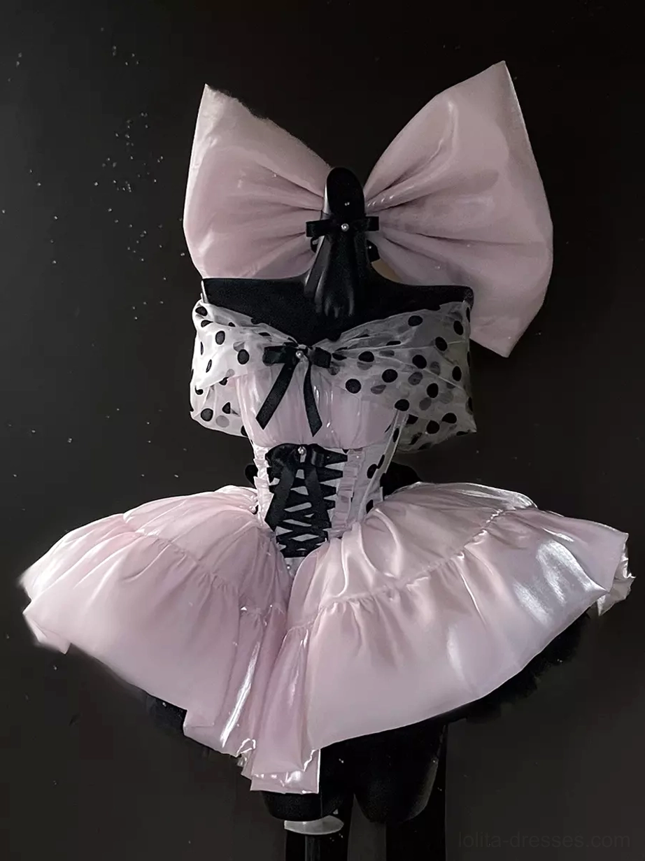 Pink polka dot ballet lolita dress close-up front view showing corset lace-up construction and short ruffled skirt detail