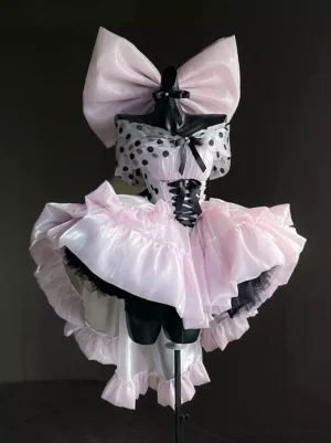 Pink polka dot ballet lolita dress front flat view with large oversized top bow and corset lace-up front on dress form