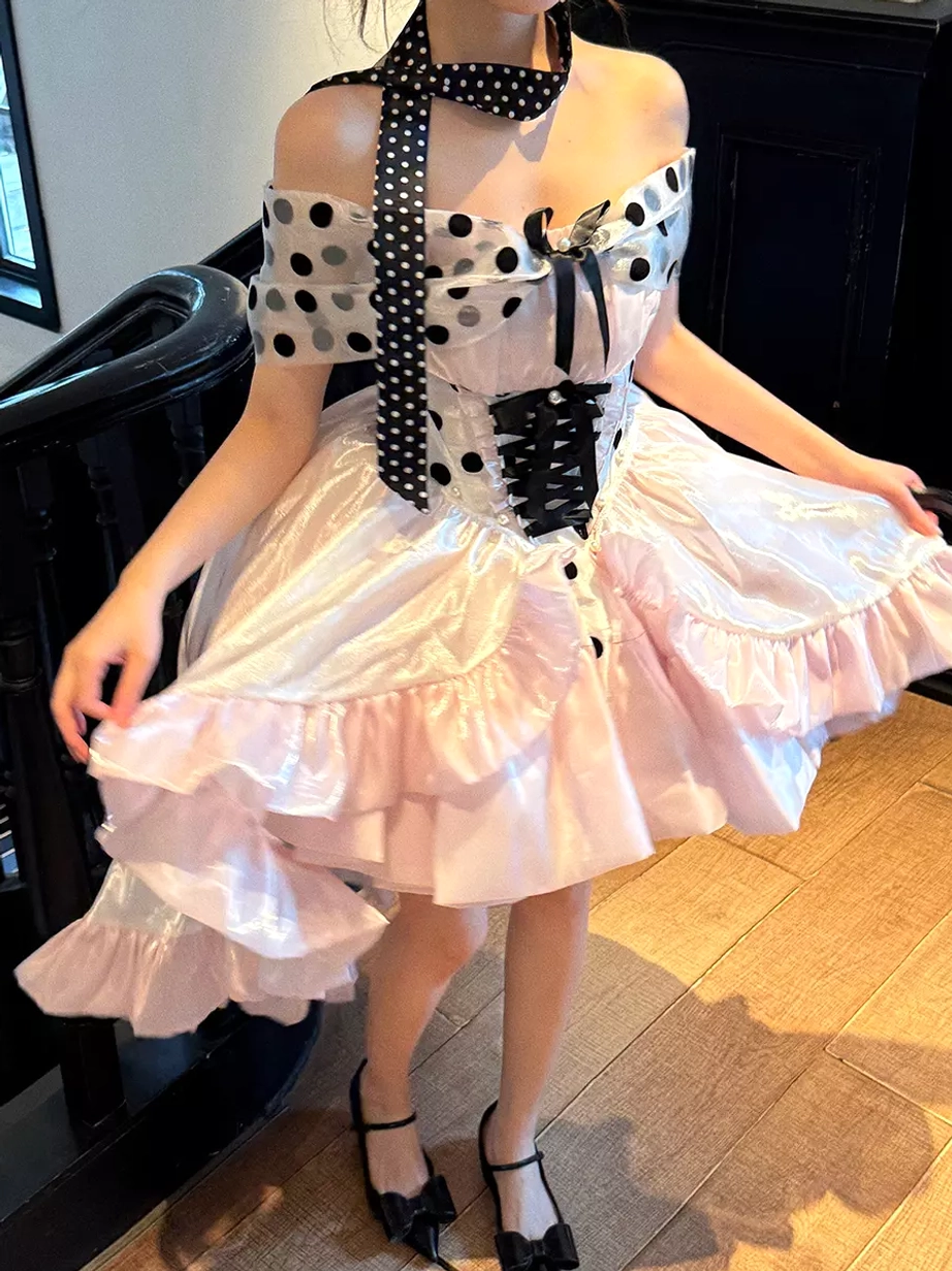Pink polka dot ballet lolita dress full body standing view female model polka dot halter scarf corset front high-low ruffled skirt black heels
