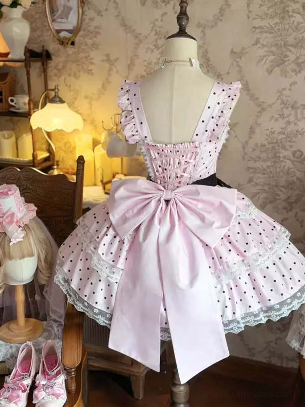 Pink polka dot sweet lolita dress back view with oversized pink bow and square back cutout tiered lace skirt