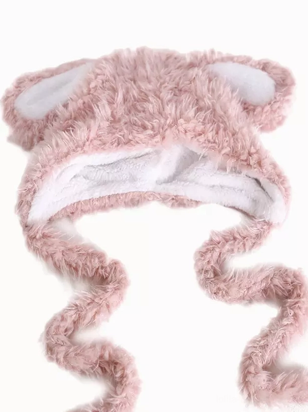 Pink plush rabbit ear Lolita hat flat lay overhead view showing white fleece lining and curved straps