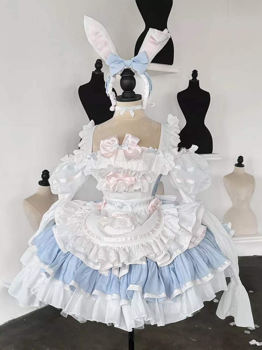 Pink rabbit maid lolita dress set with bow embellishments and frilled trims displayed on dress form, close-up front view showing detailed ruffled construction and sweet lolita style