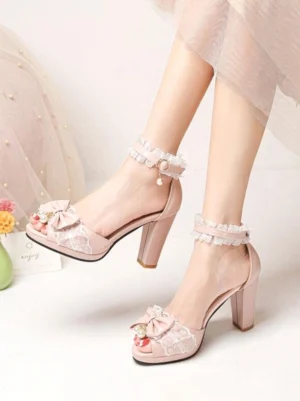 pink rococo lolita peep-toe block heel sandals with lace ruffle ankle strap and pearl bow pendant detail side view on-foot