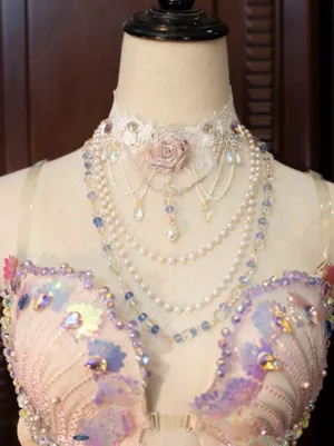 Floral lace choker necklace with pink fabric rose and iridescent crystal pearl layered chains, worn on mannequin - front flat view sweet lolita fairy aesthetic