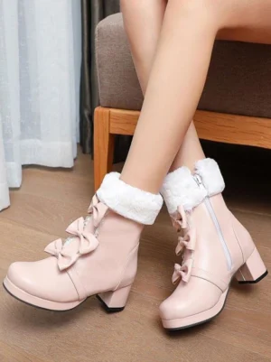Pink Sweet Lolita ankle boots with double bow ornaments and fuzzy fur cuff on model feet, side view showcasing chunky block heel and round toe design