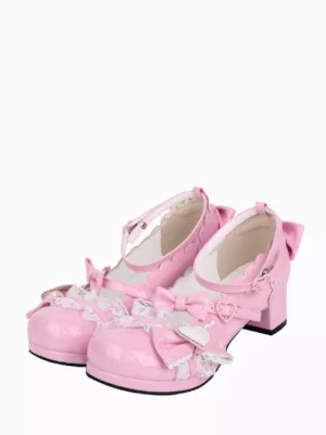 Pink sweet lolita chunky heel shoes with bow and heart charm embellishments front three-quarter view paired shoes glossy patent leather