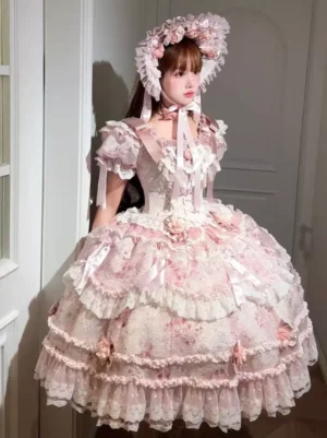 Pink sweet lolita dress front three-quarter view full-body shot showing ruffled short sleeves layered lace skirt 3D dimensional roses matching flower bonnet Victorian aesthetic