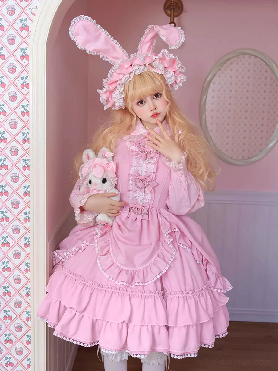 Pink Sweet Lolita dress half-body portrait with blonde model holding plush rabbit, lace apron front and ruffled collar
