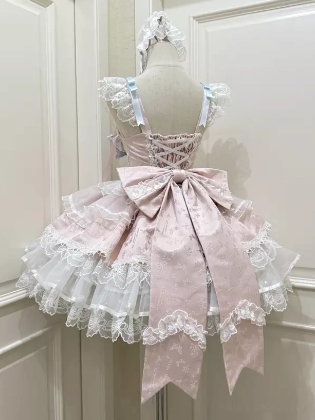 Pink sweet lolita dress rear back view large pink bow crisscross straps tiered lace detail