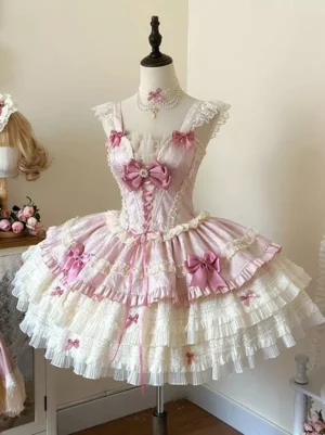 Pink sweet lolita dress front three-quarter view sleeveless ruffled straps lace trims gem-bow accents layered ruffled skirt mannequin display