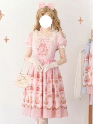 Pink Sweet Lolita dress three-quarter front studio shot featuring square neckline with floral embroidery, model holding coordinating beige handbag, bow accent on bust