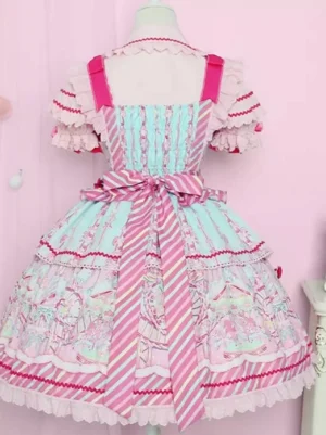 Back view of pink sweet lolita dress showing layered ruffle hem, striped waist sash, and structured silhouette on dress form