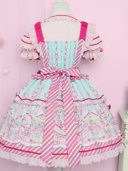 Back view of pink sweet lolita dress showing layered ruffle hem, striped waist sash, and structured silhouette on dress form