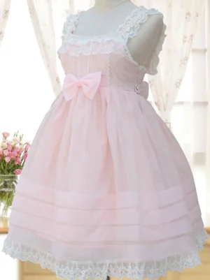 Pink sweet lolita jumper skirt JSK front three-quarter view with lace-trimmed square neckline, front pink bow, organza sheer striped skirt, and floral lace hem detail displayed on dress mannequin