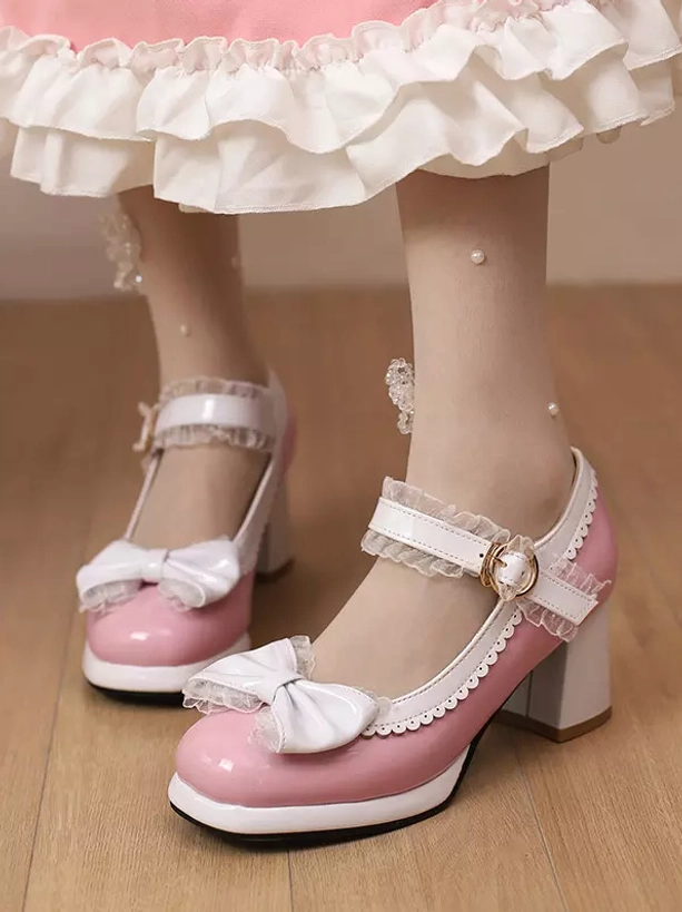 Pink Sweet Lolita Mary Jane pumps with white bow and chunky heel worn with pink ruffle skirt and lace stockings