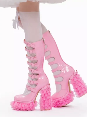 Pink patent leather sweet lolita platform boots rear view with buckle straps white stockings and frilly lolita skirt ruffled platform