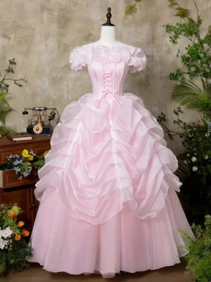 Pink off-shoulder sweet Lolita princess dress with ruffled collar and lace-up corset bodice front view showing full voluminous ruched organza skirt in vintage room setting