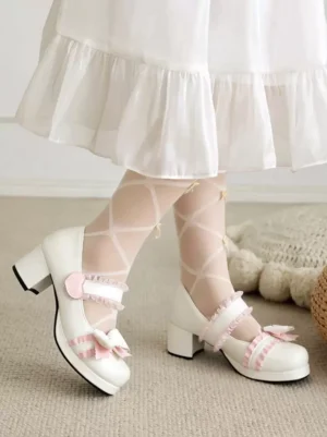Pink sweet Lolita pumps worn on model feet with sheer lace socks, side profile view highlighting ruffled ankle strap and delicate bow accent on indoor carpet