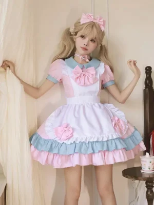 Pink sweet maid lolita dress front full body view with blue doll collar layered ruffled hem and pink bow decorations worn by model with blonde twin tail hair