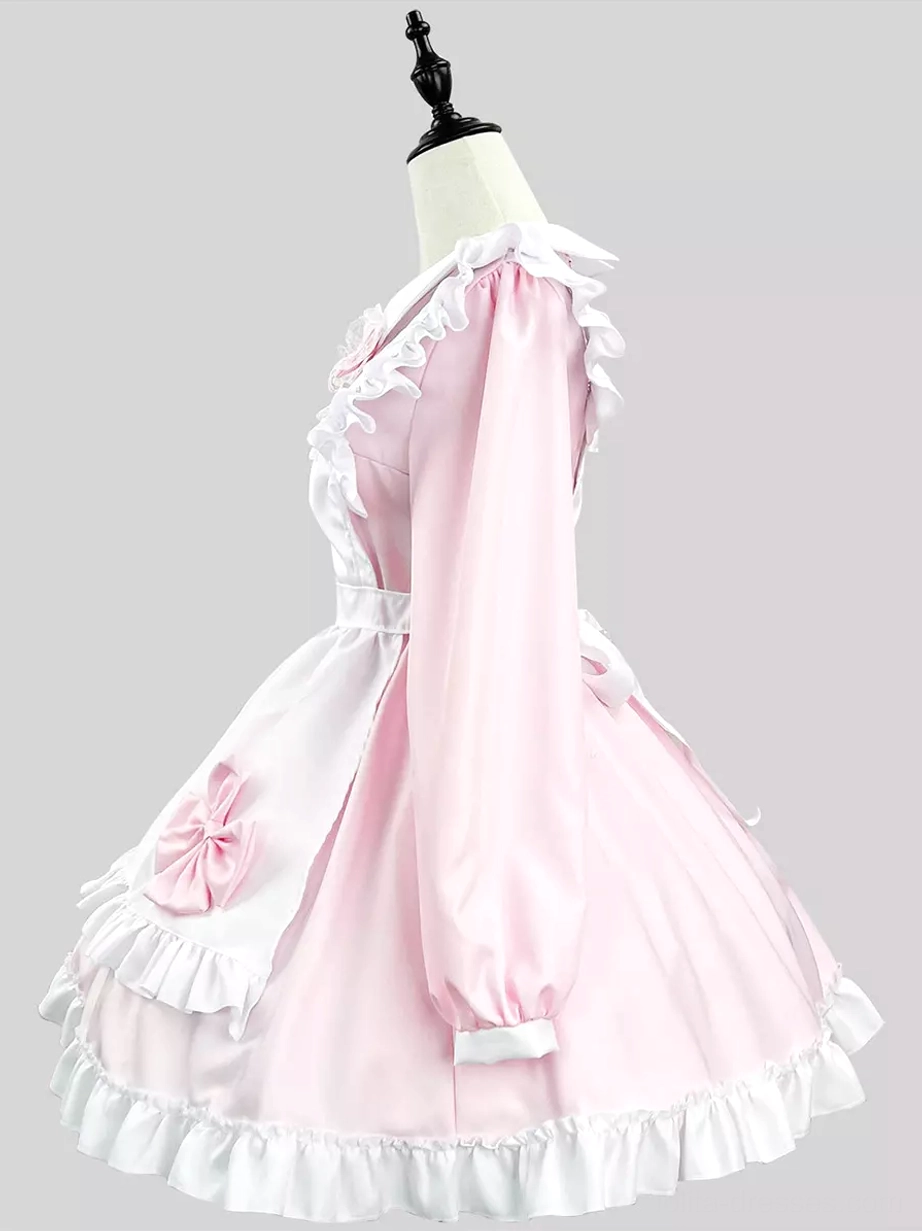 Pink maid lolita dress side view on dress form showing lantern sleeves ruffled hem and side apron bow