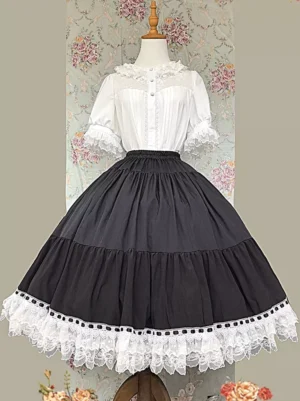 Pink tiered lolita half skirt showcasing multi-layered construction and white lace hem trim - mannequin front pose with floral backdrop