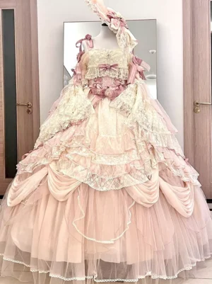 Pink vintage lolita wedding dress with square neckline layered lace tulle skirt and pink ribbon trims full frontal view