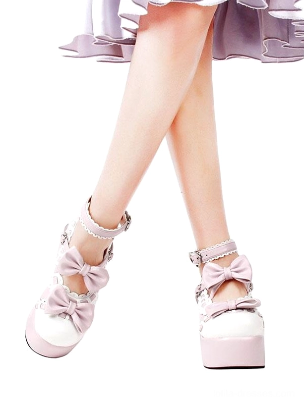 Pink and white lolita platform shoes on leg with model wearing ruffled purple skirt ankle straps detail