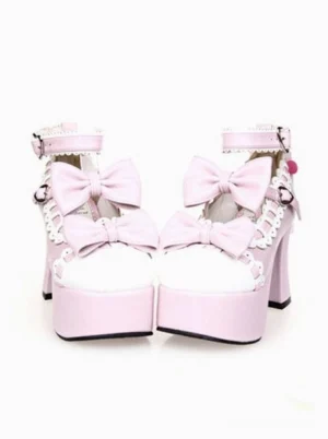 Pink and white platform lolita high heels pair front view with dual decorative bows and heart-shaped ankle buckles