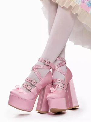 Pink Y2K lolita platform chunky heel pumps front oblique view with white stockings and lolita skirt, featuring satin upper and riveted buckle ankle straps with tiny toe bow