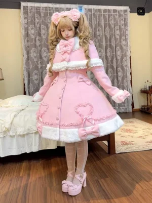 Pink Y2K sweet lolita winter coat full front view with white fur trims heart appliques and bow decorations worn by model with twin tails