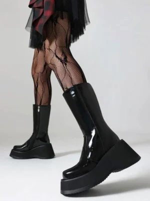 gothic platform boots front three-quarter view glossy patent leather thick wedge sole ruffled plaid skirt