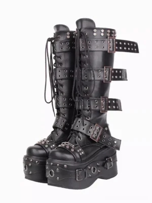 Punk gothic lolita platform boots with studded grommets and metal hardware, front paired view on white background, thick wedge heel and buckle straps visible