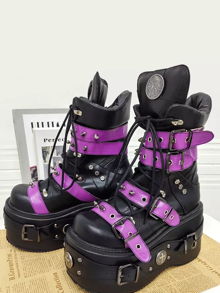 Punk lolita platform boots front three-quarter view silver metal buckles purple leather straps thick wedge sole studio setting