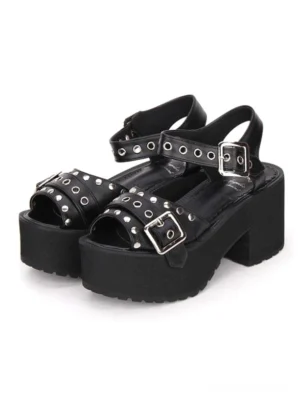 Black punk Lolita platform sandals front three-quarter view showing metallic buckles and decorative grommet rivets on white background
