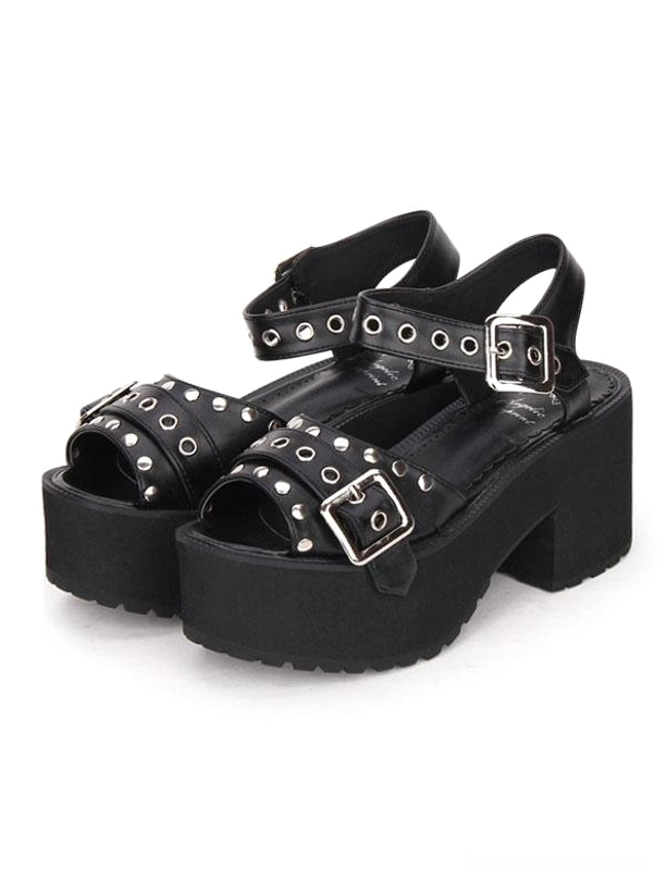 Black punk Lolita platform sandals front three-quarter view showing metallic buckles and decorative grommet rivets on white background