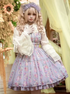 Purple floral sweet lolita JSK dress with tiered ruffles and bow embellishments worn by blonde model with purple hairband and white gloves, front three-quarter view with lace-trimmed white inner blouse