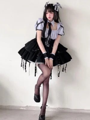 Purple gothic lolita dress with lace-up corset front and black grommets, full front-side view on model wearing twin hair bows, short puff sleeves with square neckline and layered ruffle skirt