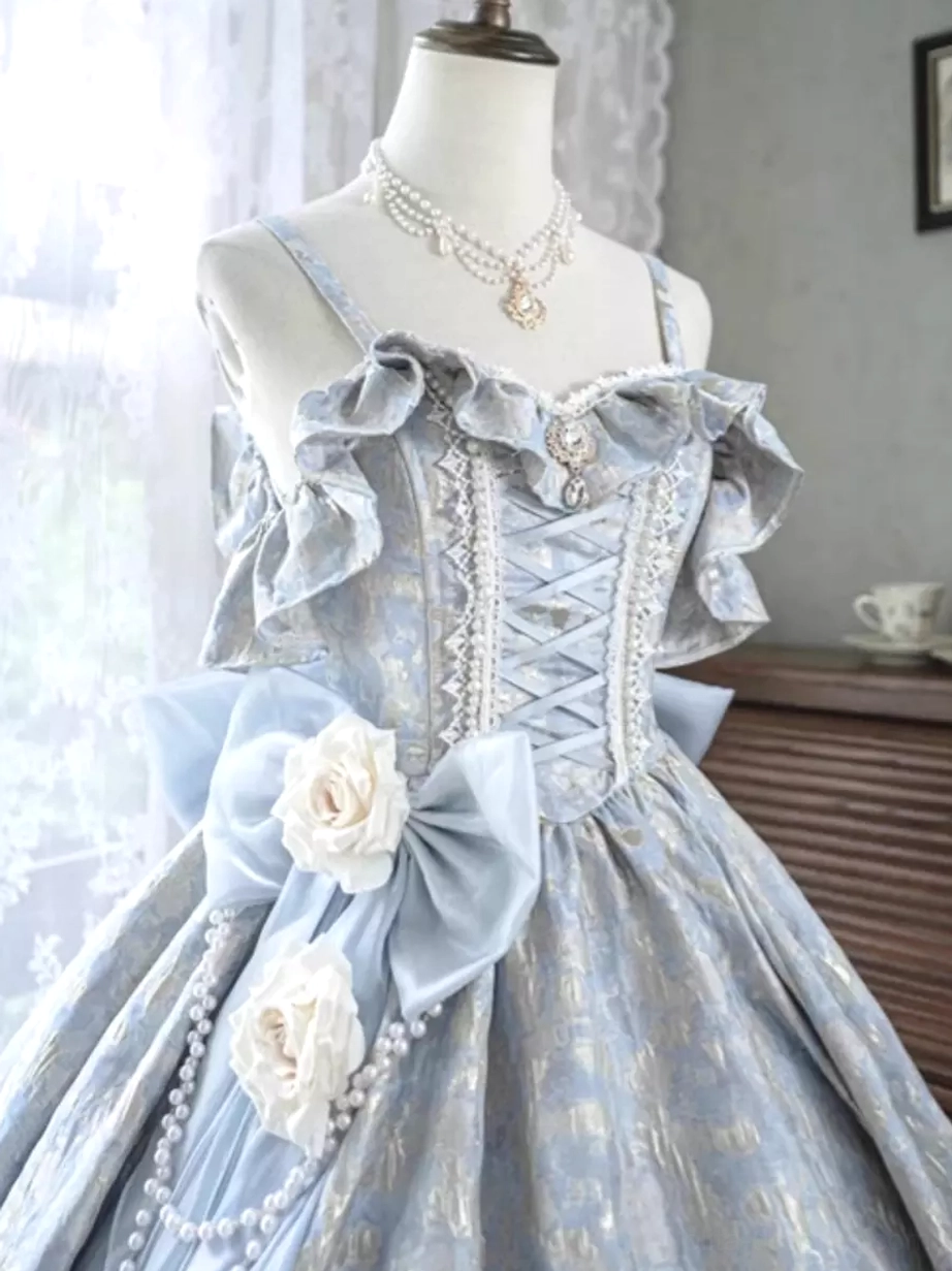 Close-up bodice detail of purple Classic Lolita dress showing lace-up corset front ruffled neckline ornate bow with roses and pearl trim embellishments