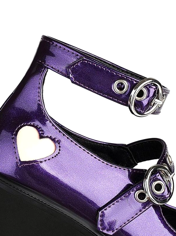 Close-up side view of purple lolita platform shoe showing adjustable metal buckles, heart-shaped leather decoration, and thick chunky black heel