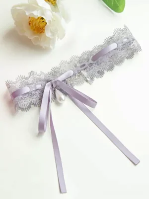 Purple pearl lace choker with satin bow sweet lolita accessory flat lay featuring white pearl pendant and delicate lace detailing