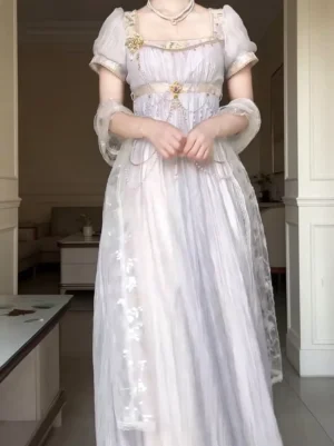 Front view of purple Regency Lolita ball gown with square puff sleeves, empire waist, decorative gold brooch and chain embellishments, light lavender sweet lolita dress
