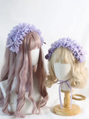 Purple ruffled lace Lolita headband with side bow decorations and satin ribbon ties displayed on mannequin heads, front view showcasing intricate lace details
