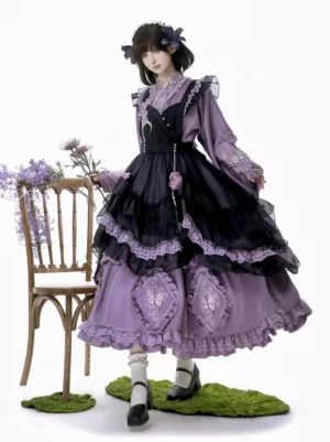 Purple Sweet Lolita 2-piece dress set with butterfly embroidery and apron overlay, front three-quarter view showcasing cross-collar neckline and layered skirt