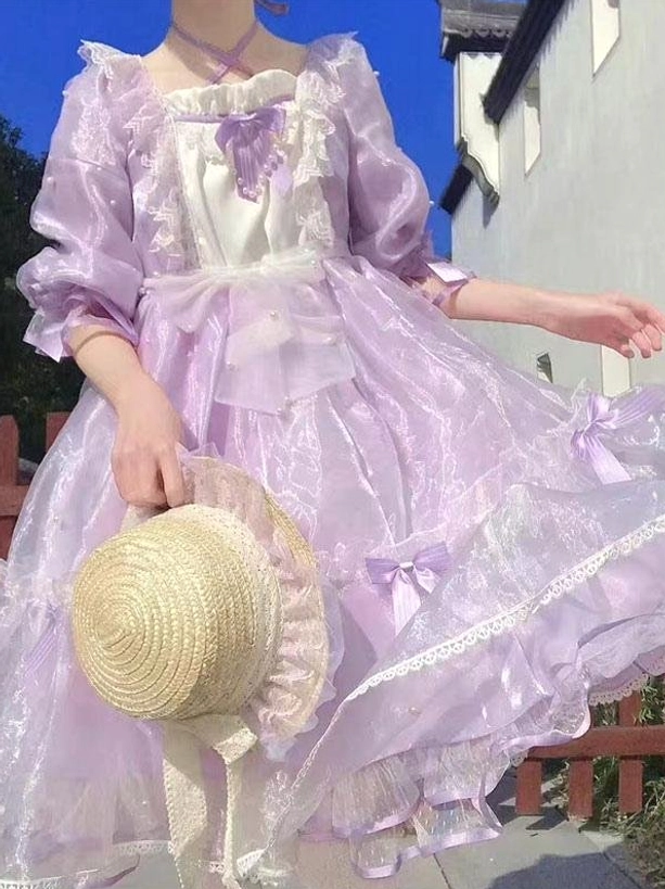Purple sweet lolita fairy dress upper-body outdoor street setting with puffy ruffled half sleeves purple bow satin bodice